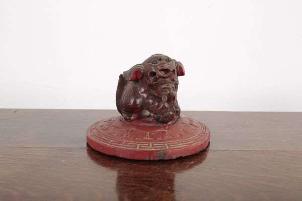 A CHINESE RED PAINTED WOODEN KYLIN