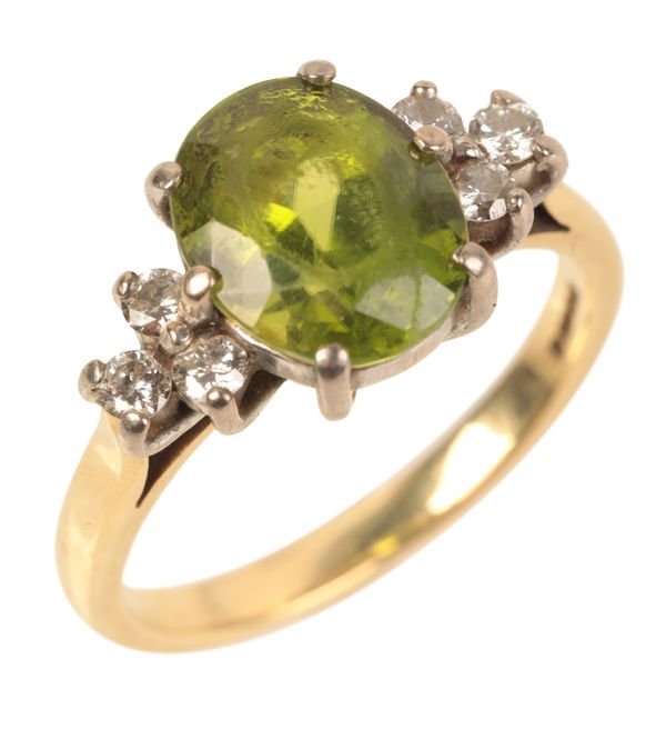 AN 18CT GOLD PERIDOT AND DIAMOND RING