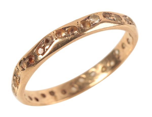 A 9CT GOLD GEM SET ETERNITY RING