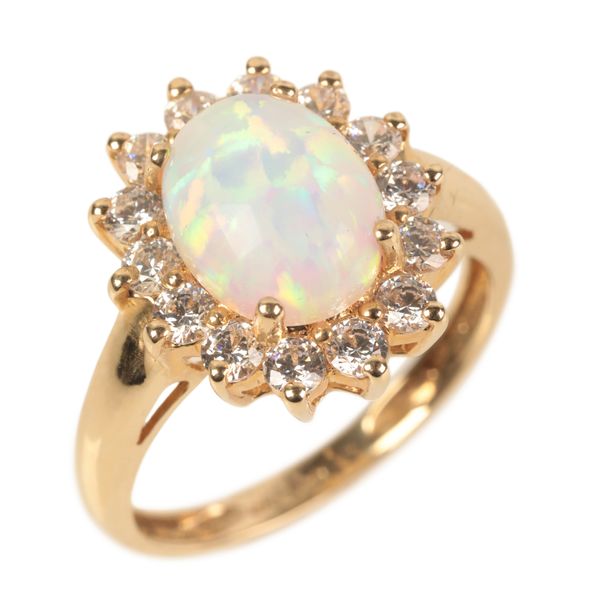 A 14CT GOLD SYNTHETIC OPAL AND CUBIC ZIRCONIA RING