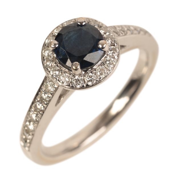 AN 18CT WHITE GOLD SAPPHIRE AND DIAMOND HALO RING