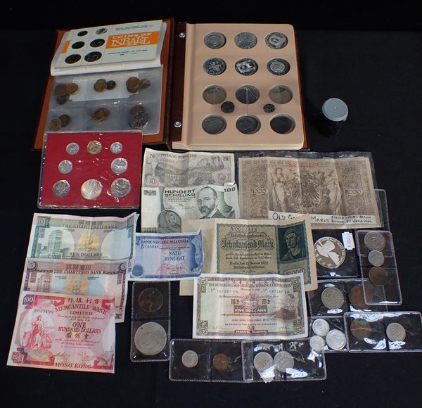 A 'CROWNS OF THE WORLD' COIN ALBUM, WITH SOME CONTENTS