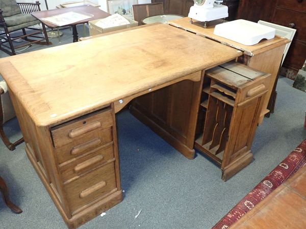 AN EDWARDIAN LIGHT OAK OFFICE DESK