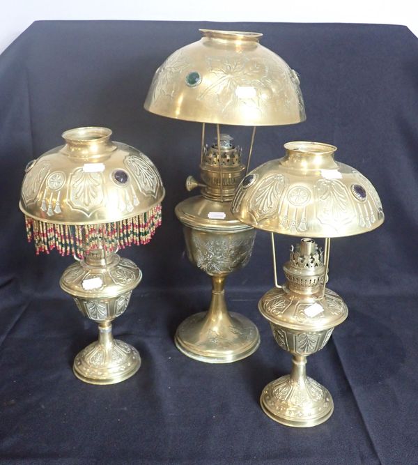 THREE EARLY 20TH CENTURY FRENCH BRASS TABLE OIL LAMPS