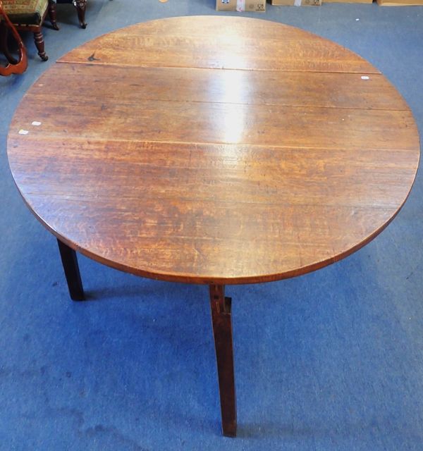 A GEORGE III OAK OVAL DROP-LEAF TABLE