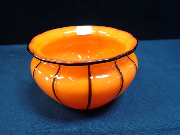 AN ORANGE ART GLASS BOWL