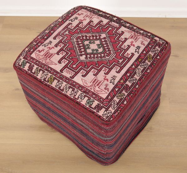 A CARPET COVERED STOOL