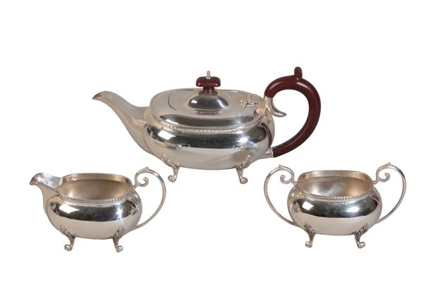 AN ELIZABETH II SILVER THREE PIECE TEA SERVICE