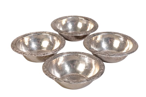 A SET OF FOUR PERUVIAN WHITE METAL BOWLS