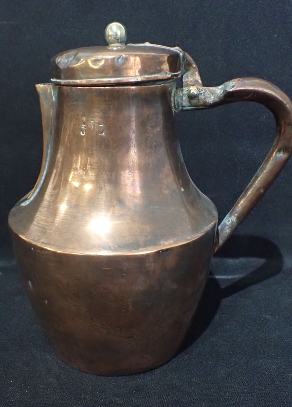 A COPPER JUG WITH HINGED LID