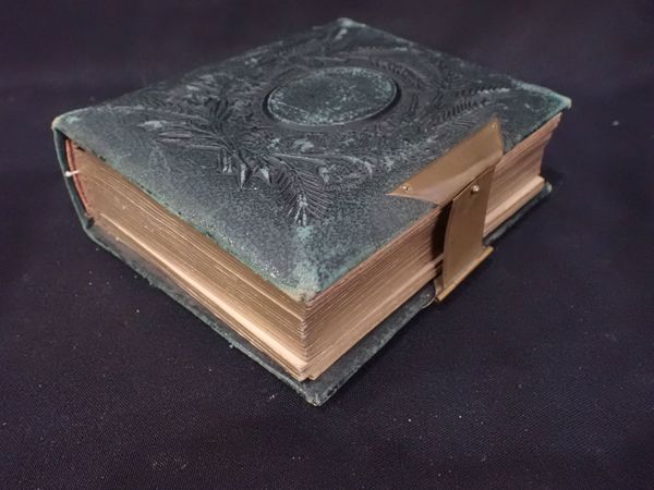 A VICTORIAN GREEN LEATHER PHOTOGRAPH ALBUM