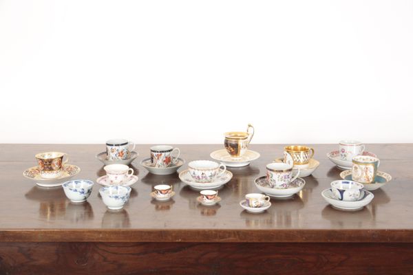 A COLLECTION OF CABINET CUPS AND SAUCERS