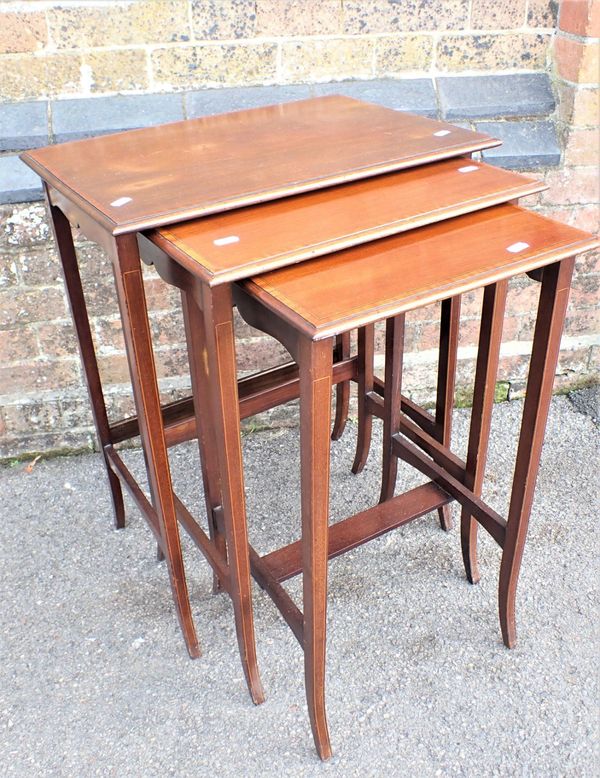 A NEST OF THREE EDWARDIAN MAHOGANY OCCASIONAL TABLES