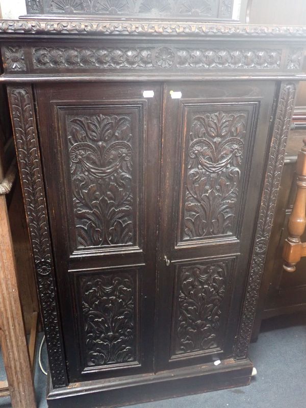 A VICTORIAN CARVED OAK CABINET