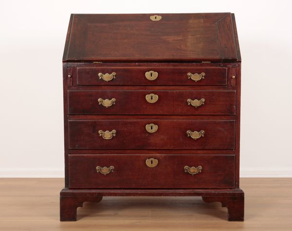 AN EARLY GEORGE III MAHOGANY BUREAU