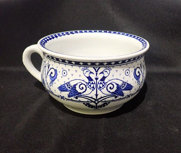 A BROWNFIELD ‘OLYMPUS’ BLUE AND WHITE POTTERY CHAMBER POT