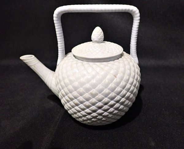 A CORBRIDGE PALE BLUE ‘RAFFIA WARE’ POTTERY TEA POT AND COVER