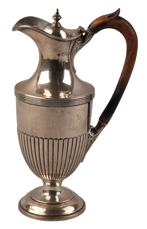 A LATE VICTORIAN SILVER HOT WATER JUG