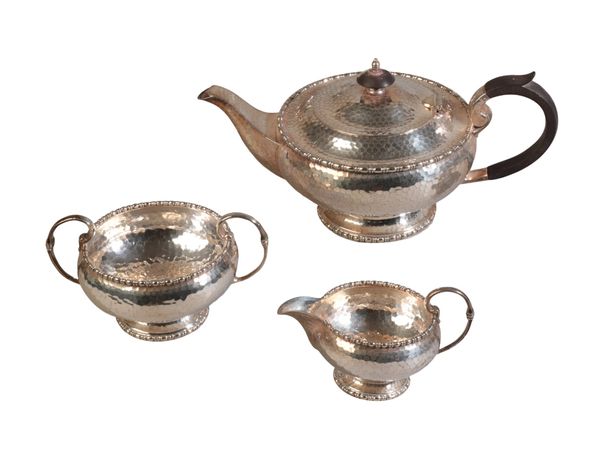 AN EARLY 20th CENTURY SILVER PLATED THREE PIECE TEA SERVICE