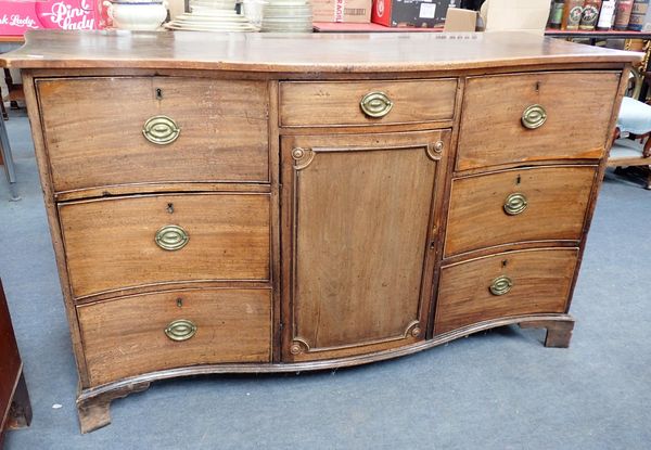 A GEORGE III MAHOGANY SERPENTINE SIDEBOARD