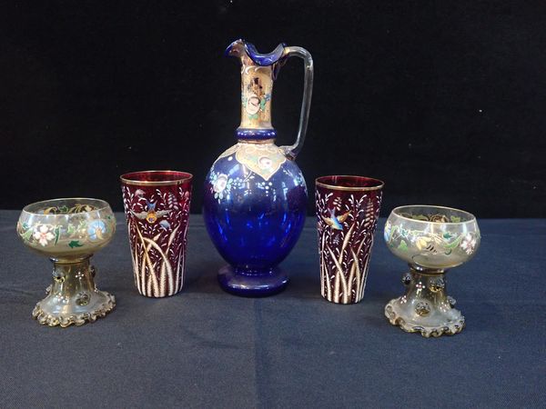 AN ENAMELLED AND GILDED BLUE GLASS JUG