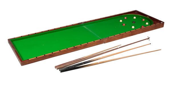 A MAHOGANY FOLDING TABLE-TOP BAGATELLE BOARD