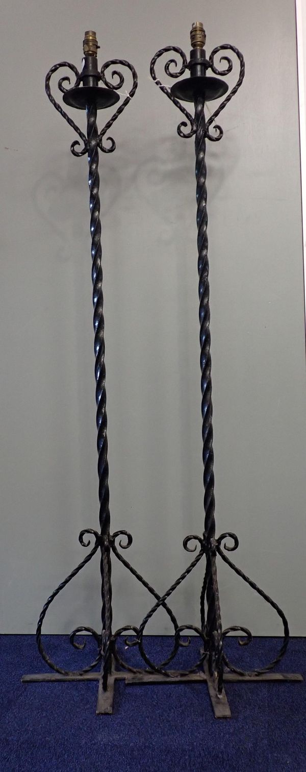 A PAIR OF WROUGHT IRON STANDARD LAMPS