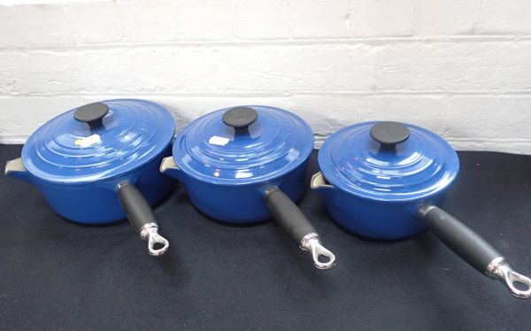 A SET OF THREE LE CREUSET PANS