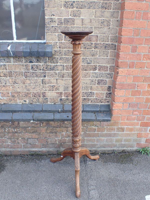 A MAHOGANY 'BEDPOST' TORCHERE