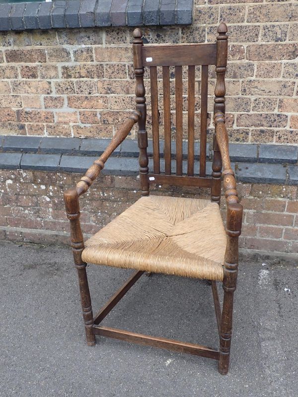 AN OAK 'BREWSTER' STYLE CHAIR