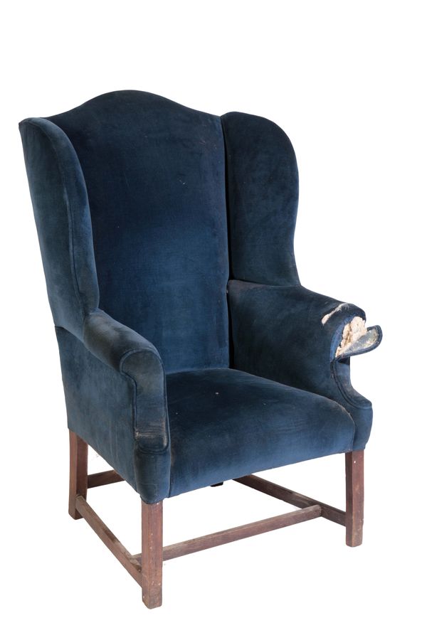 A GEORGE III OAK AND UPHOLSTERED WINGBACK ARMCHAIR