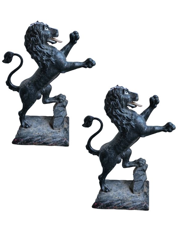 A PAIR OF SUBSTANTIAL IRON PIER FINIALS  CAST AS RAMPANT LIONS,