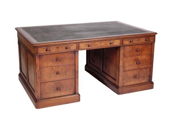 A VICTORIAN WALNUT AND LEATHER INSET PARTNERS DESK,