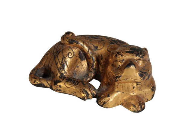 GILT-BRONZE LION SCROLL WEIGHT, MING OR LATER