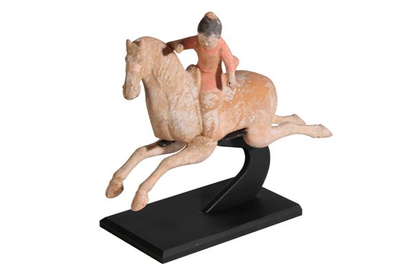 PAINTED POTTERY FIGURE OF A FEMALE POLO PLAYER, MING DYNASTY