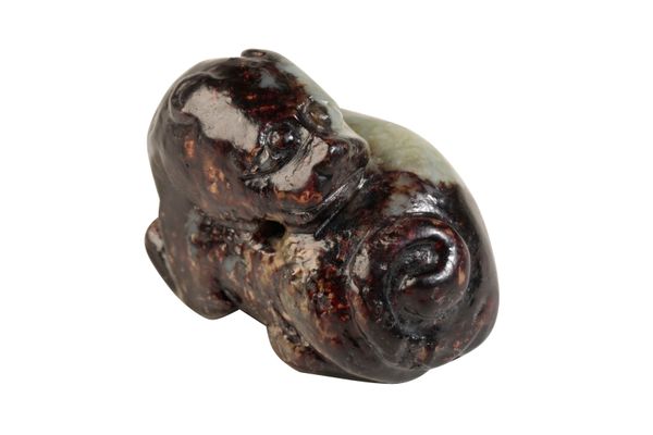 SMALL RUSSET JADE CARVING OF A LION, MING DYNASTY