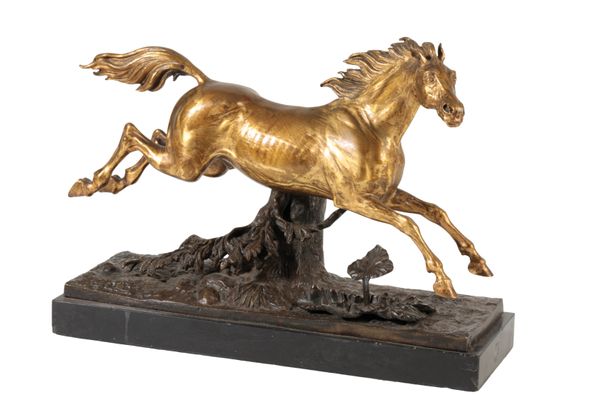 CONTINENTAL GILT BRONZE MODEL OF A LEAPING HORSE