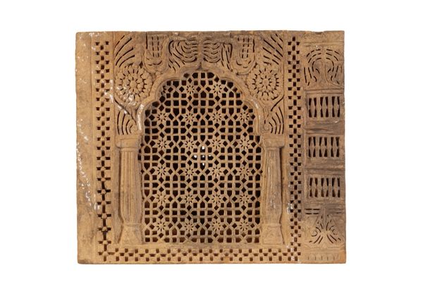 A MIDDLE EASTERN CARVED LIMESTONE RELIEF PANEL,