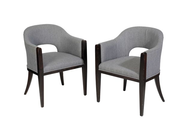 A PAIR OF UPHOLSTERED TUB CHAIRS