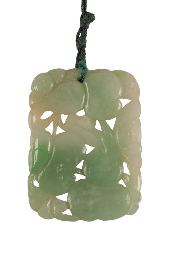 A FINE CARVED JADEITE PENDANT