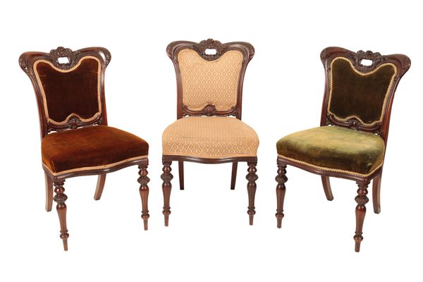 A SET OF SIX VICTORIAN CARVED ROSEWOOD AND UPHOLSTERED DINING CHAIRS,