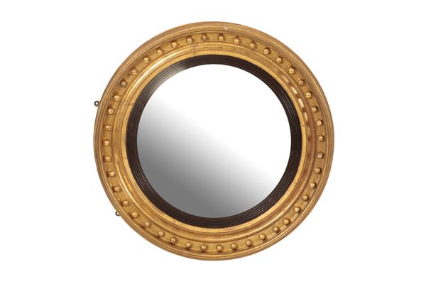 A REGENCY GILTWOOD FRAMED CONVEX WALL MIRROR,