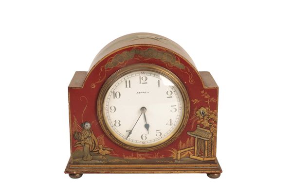 A RED JAPANNED MANTEL CLOCK