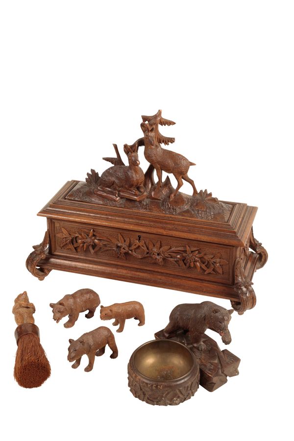 A 'BLACK FOREST' CARVED AND STAINED LINDEN WOOD BOX AND A CACHE POT WITH A BEAR,