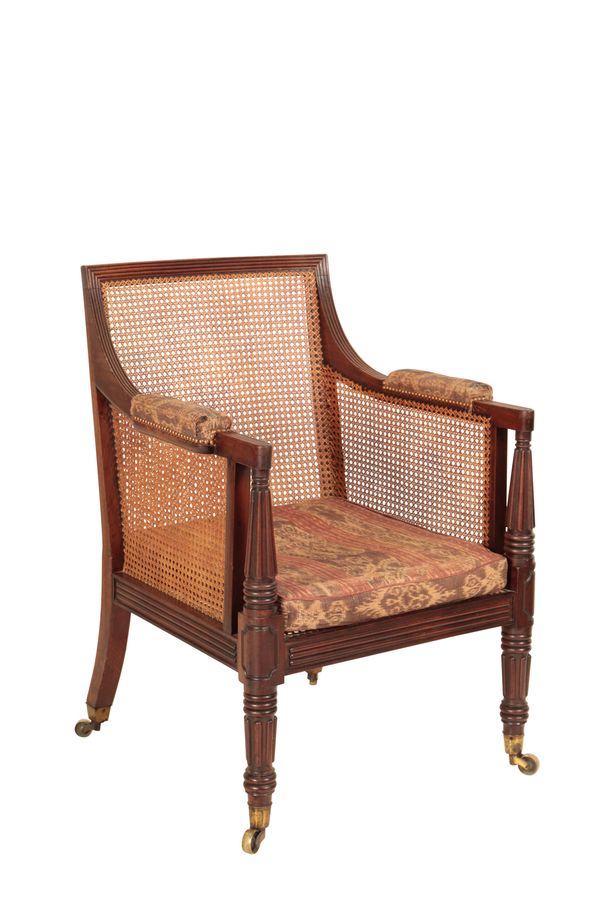 A REGENCY MAHOGANY AND CANEWORK LIBRARY BERGERE