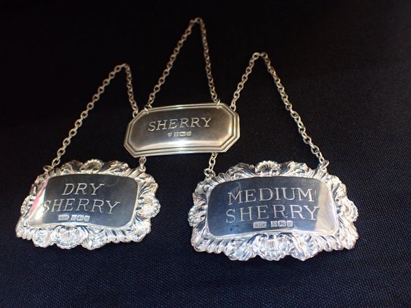 A PAIR OF SILVER DECANTER LABELS