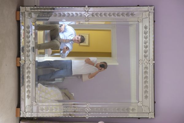 A LARGE VENETIAN STYLE MIRROR
