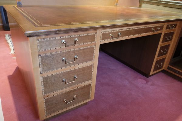 A LARGE HARDWOOD VENEERED AND PARQUETRY DESK BY MARTIN DODGE
