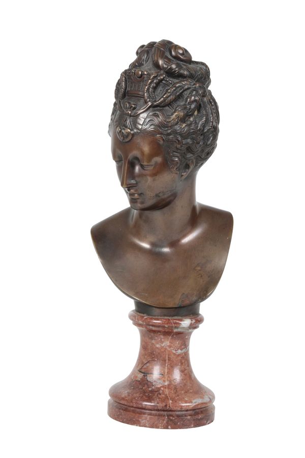 AFTER JEAN-ANTOINE HOUDON, (FRENCH, 1741 – 1828), A BRONZE BUST OF A MAIDEN,