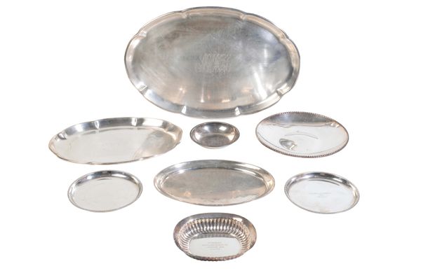 A GROUP OF EIGHT SILVER COLOURED DISHES,